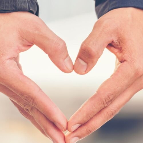 Fools in Love Blog Cover Art with two hands forming the shape of a heart.