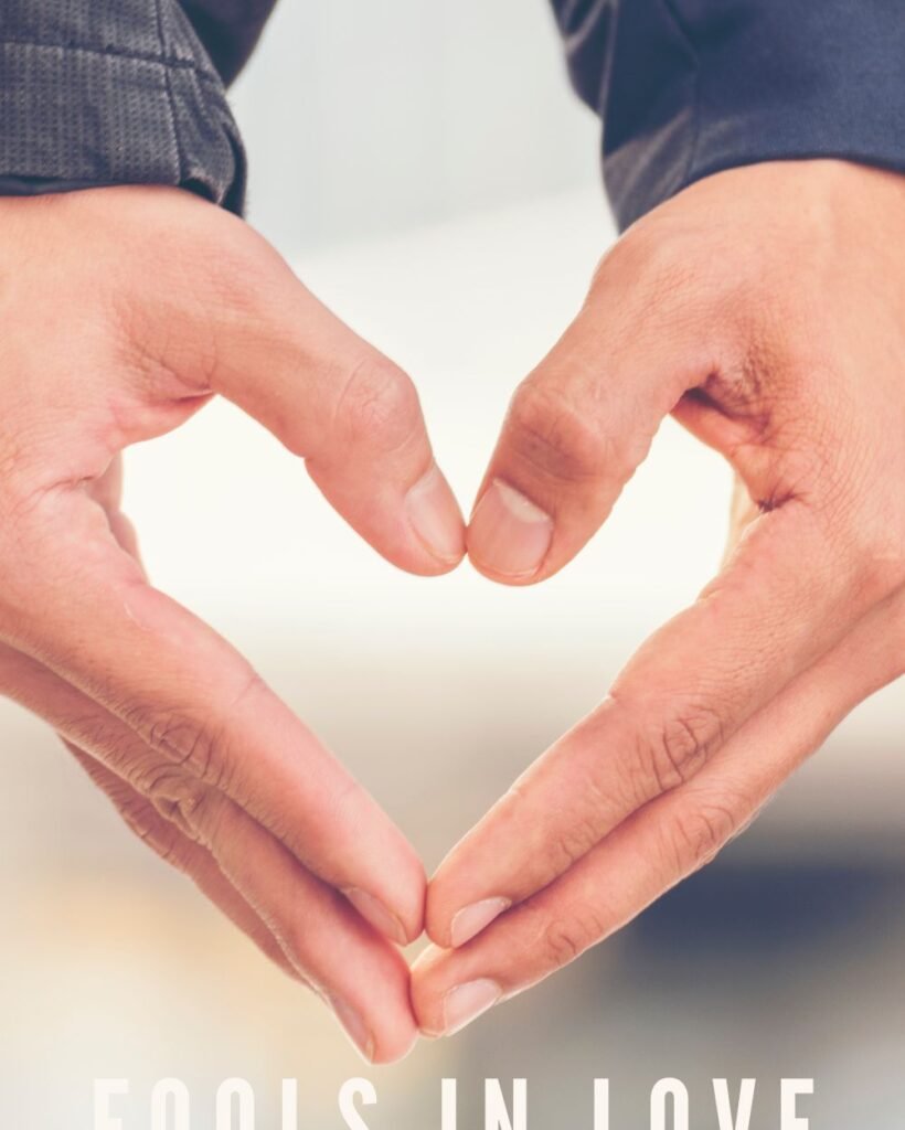 Fools in Love Blog Cover Art with two hands forming the shape of a heart.