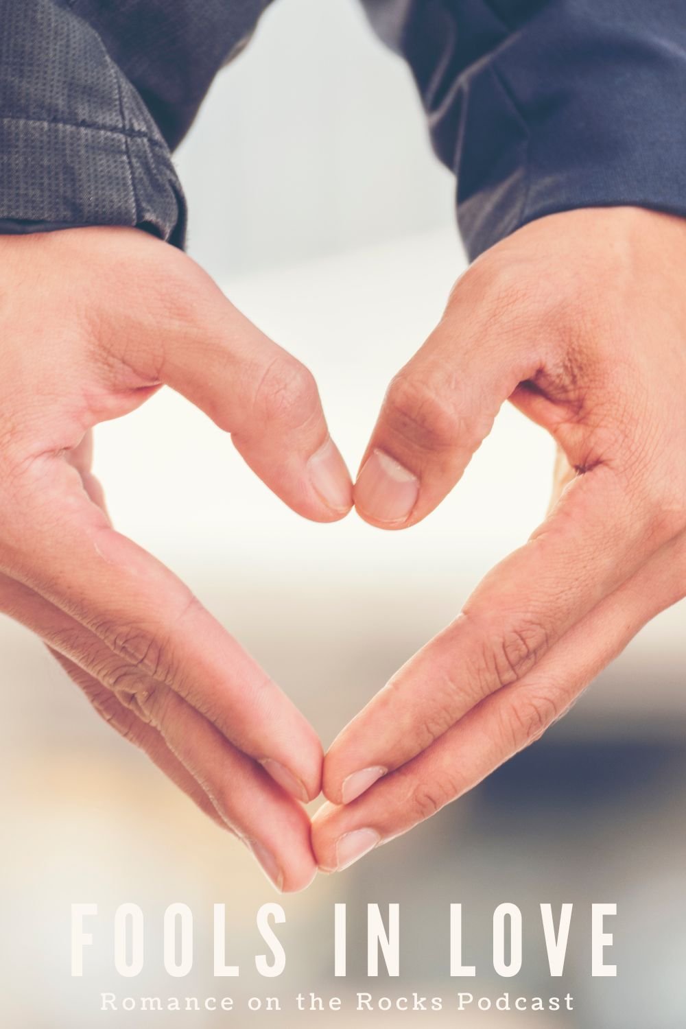 Fools in Love Blog Cover Art with two hands forming the shape of a heart.